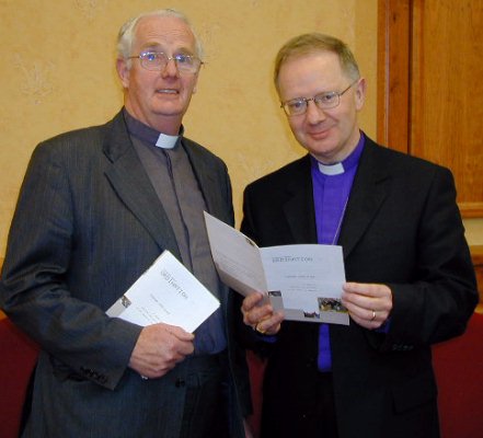 Canon Cecil Hyland & Bishop Richard Clarke with the new Ordination handbook