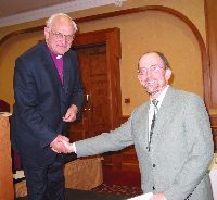 Mr H Sharman receiving his award for winning the diocesan magazine category