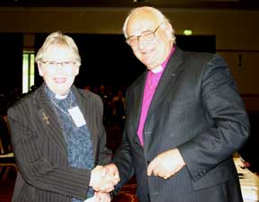 Winner of the Caption Competition, Rev Janet White-Spunner receives congratulations from the Archbishop of Armagh
